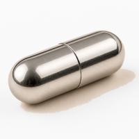 Metallic capsule-shaped object on a white background